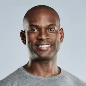 fit-handsome-smiling-man-in-gray-shirt-e1622613290172-pmvko10b1uv7ult4rimlhwber199sdvvsxu22lamrc.webp